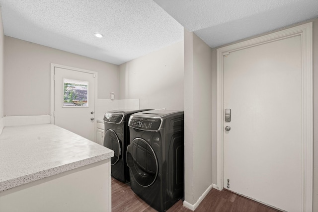 9827 Gold Cup Way, Houston, TX 77065 - laundry room with wood finished floors, washing machine and clothes dryer, and a textured ceiling