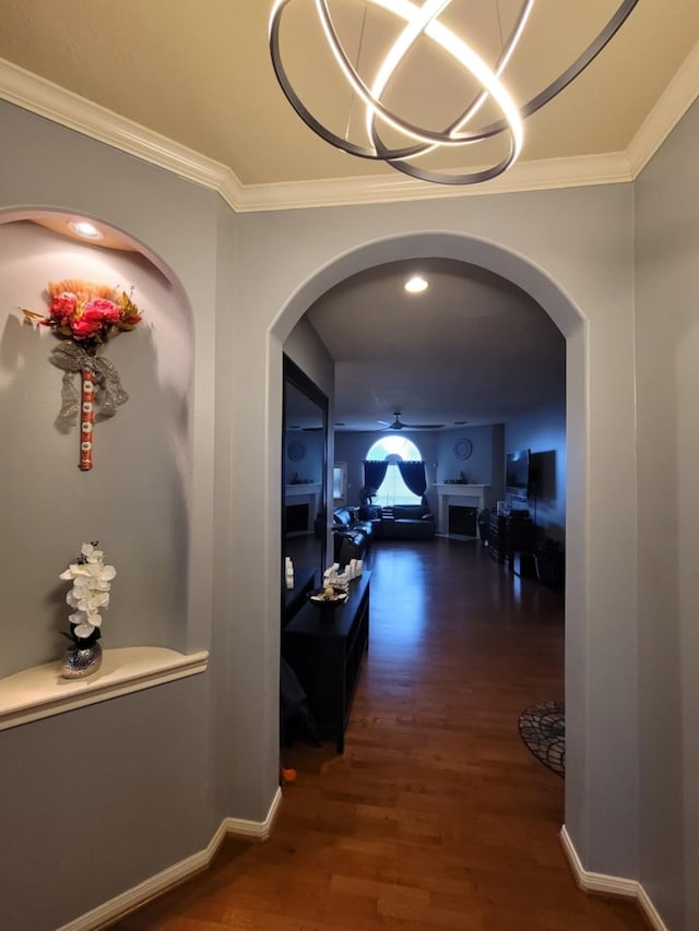 3214 Worthington Dr, Pearland, TX 77584 - hall with arched walkways, wood finished floors, and crown molding