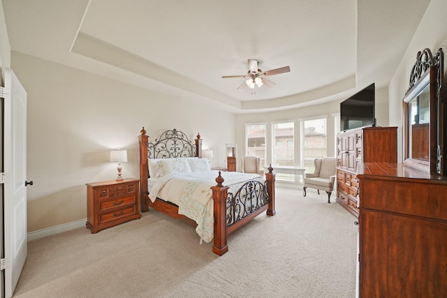 19831 Indigo Key Ct, Cypress, TX 77433 - bedroom with a raised ceiling, light colored carpet, and multiple windows