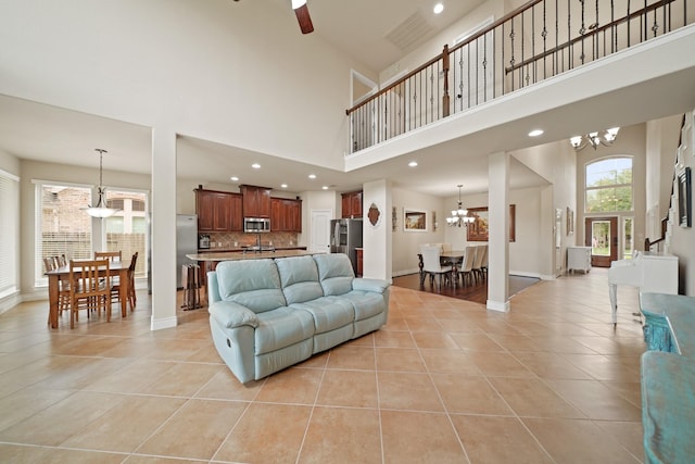 19831 Indigo Key Ct, Cypress, TX 77433 - living area with a chandelier, light tile patterned floors, a high ceiling, recessed lighting, and a ceiling fan