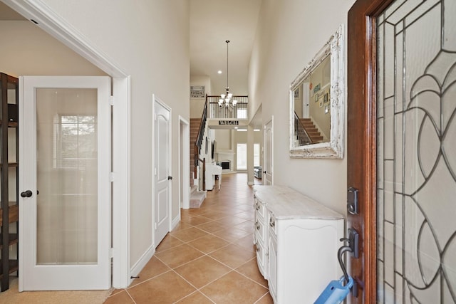 19831 Indigo Key Ct, Cypress, TX 77433 - foyer entrance with a high ceiling, a chandelier, and light tile patterned floors