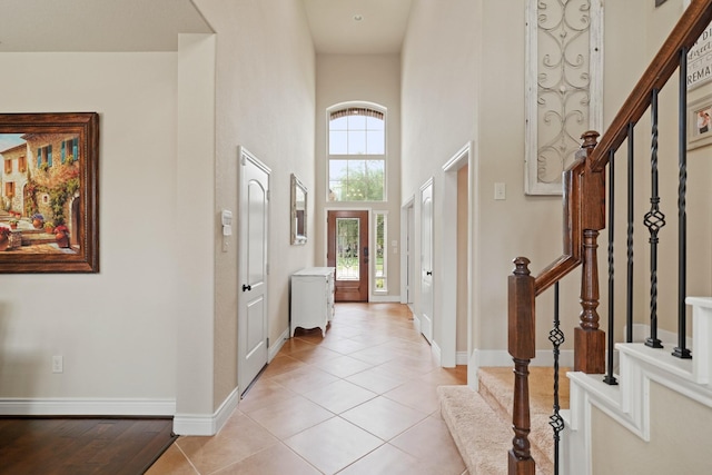 19831 Indigo Key Ct, Cypress, TX 77433 - entryway featuring stairway, a high ceiling, and light tile patterned floors