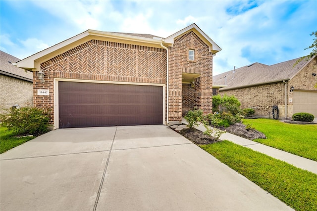 11442 Harmony Summit Trce, Richmond, TX 77406 - view of front of home featuring brick siding, driveway, a garage, and a front yard