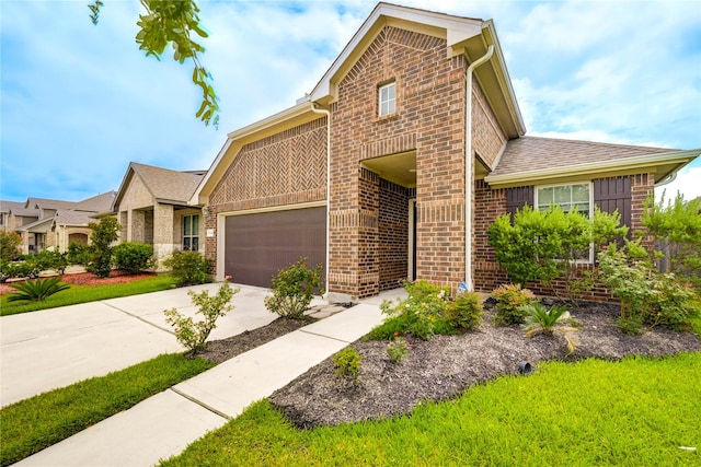 11442 Harmony Summit Trce, Richmond, TX 77406 - view of front of house featuring brick siding, concrete driveway, a shingled roof, and an attached garage