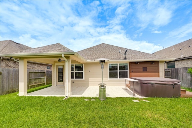 11442 Harmony Summit Trce, Richmond, TX 77406 - back of property with a hot tub, a patio, a ceiling fan, and a fenced backyard