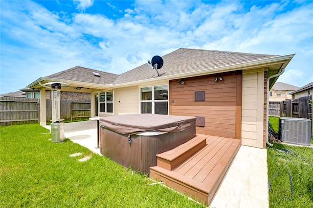 11442 Harmony Summit Trce, Richmond, TX 77406 - rear view of house with a hot tub, a fenced backyard, a patio area, and a shingled roof