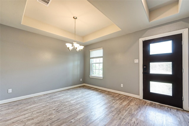 11442 Harmony Summit Trce, Richmond, TX 77406 - entrance foyer featuring a raised ceiling, wood finished floors, and a chandelier