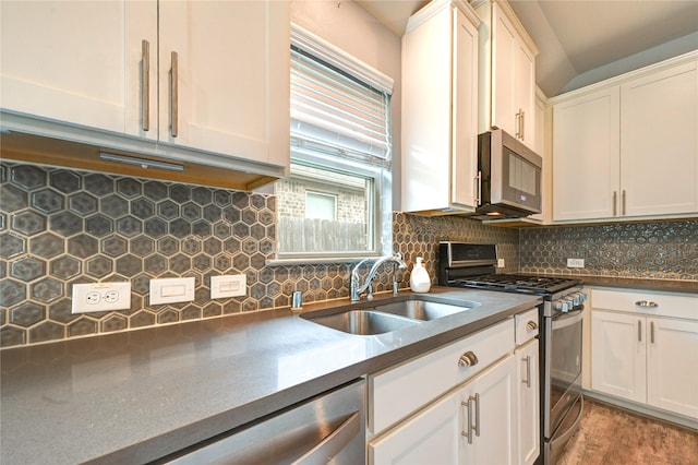 11442 Harmony Summit Trce, Richmond, TX 77406 - kitchen with stainless steel appliances, tasteful backsplash, white cabinetry, and dark countertops