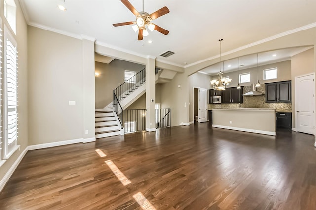 6107 Stillman St, Houston, TX 77007 - unfurnished living room featuring a chandelier, a ceiling fan, recessed lighting, crown molding, and dark wood finished floors