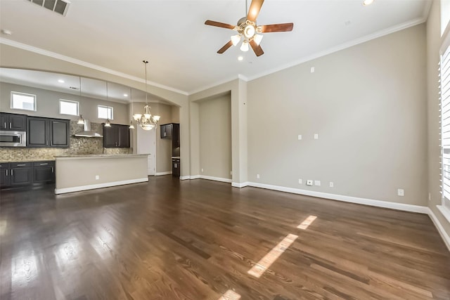 6107 Stillman St, Houston, TX 77007 - unfurnished living room featuring a chandelier, ceiling fan, dark wood finished floors, recessed lighting, and crown molding