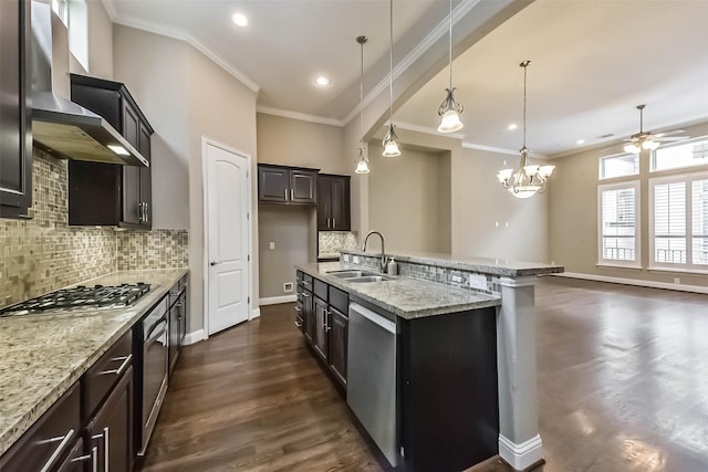 6107 Stillman St, Houston, TX 77007 - kitchen featuring wall chimney exhaust hood, ornamental molding, dark wood-style floors, ceiling fan, and tasteful backsplash