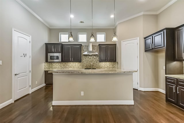 6107 Stillman St, Houston, TX 77007 - kitchen with stainless steel microwave, wall chimney exhaust hood, dark wood-style floors, ornamental molding, and recessed lighting
