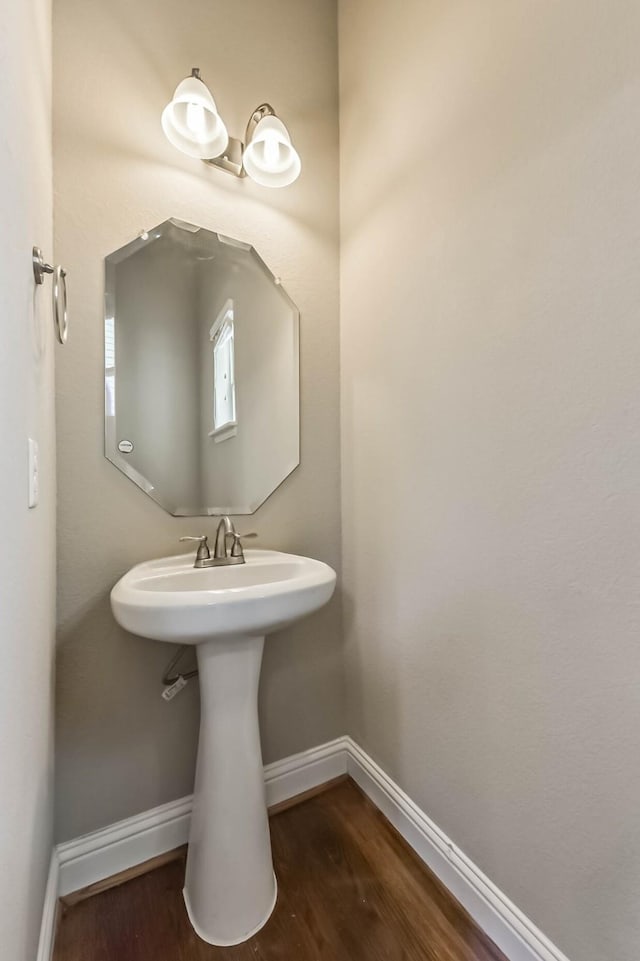 6107 Stillman St, Houston, TX 77007 - bathroom featuring baseboards and wood finished floors