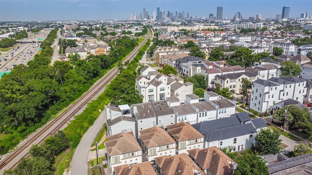 6107 Stillman St, Houston, TX 77007 - aerial perspective of suburban area featuring city skyline