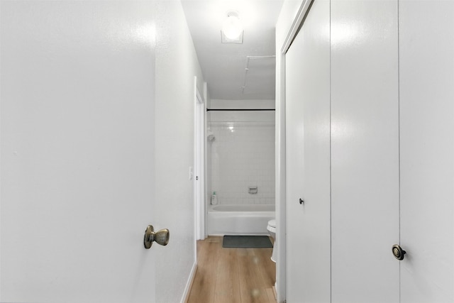 9809 Richmond Ave Unit H10, Houston, TX 77042 - hallway featuring light wood-style flooring and baseboards