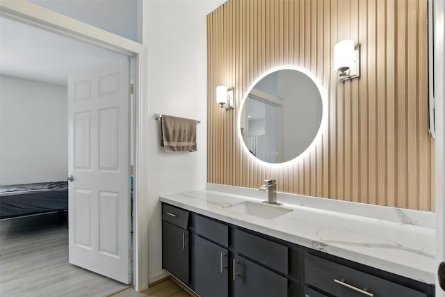 9809 Richmond Ave Unit H10, Houston, TX 77042 - bathroom with vanity and wood finished floors