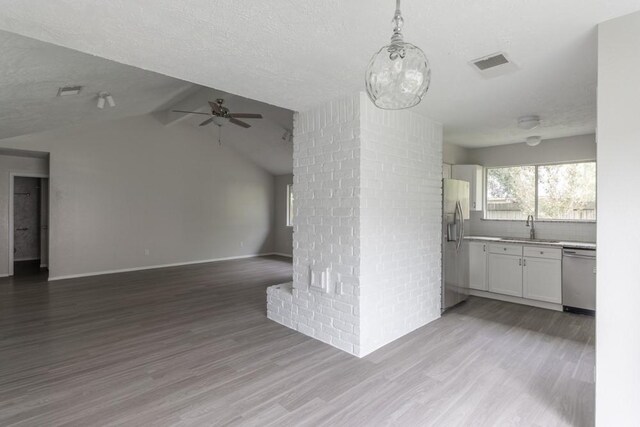 15803 Cerca Blanca Dr, Houston, TX 77083 - unfurnished living room featuring ceiling fan, wood finished floors, and lofted ceiling
