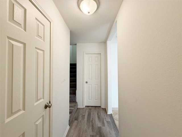 10912 Gulf Fwy Unit 68, Houston, TX 77034 - hall with wood finished floors and baseboards