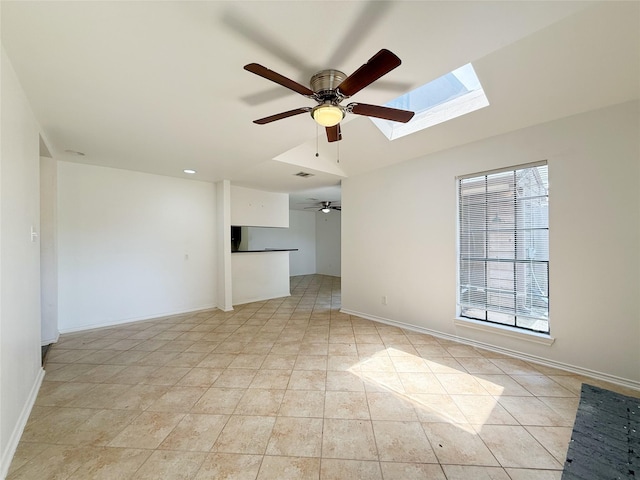 10912 Gulf Fwy Unit 68, Houston, TX 77034 - empty room with ceiling fan, a skylight, and light tile patterned flooring