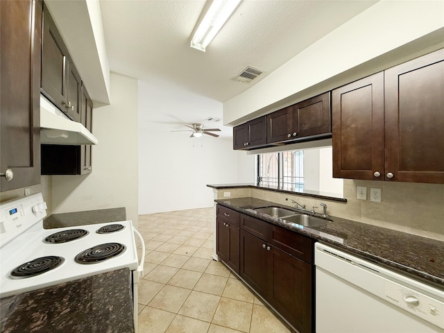 10912 Gulf Fwy Unit 68, Houston, TX 77034 - kitchen featuring white appliances, under cabinet range hood, ceiling fan, dark brown cabinetry, and dark stone counters