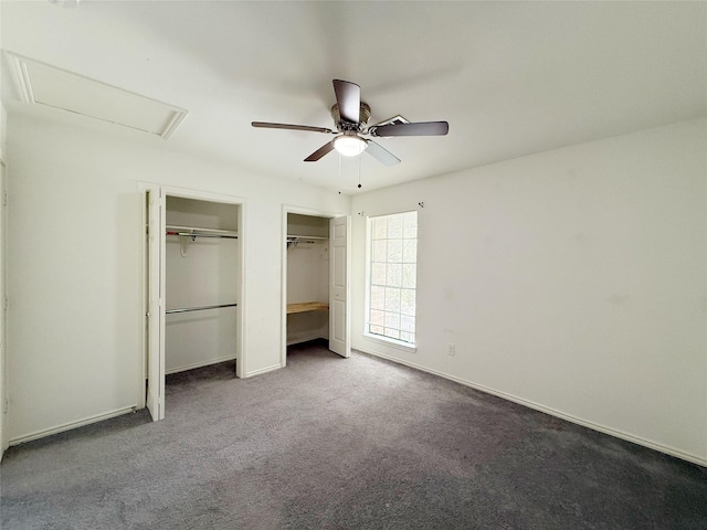 10912 Gulf Fwy Unit 68, Houston, TX 77034 - unfurnished bedroom featuring two closets, attic access, carpet floors, and a ceiling fan