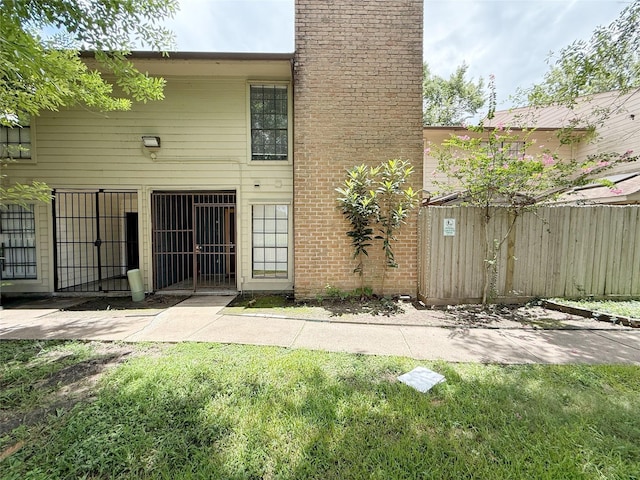 10912 Gulf Fwy Unit 68, Houston, TX 77034 - rear view of house featuring a chimney