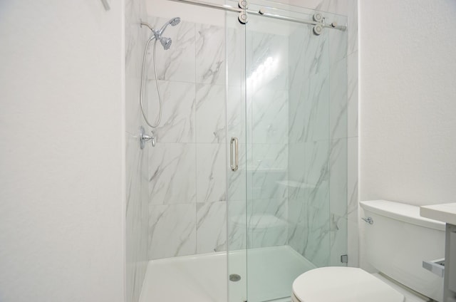 6514 Fraser Point Ct, Spring, TX 77379 - full bathroom featuring toilet and a marble finish shower
