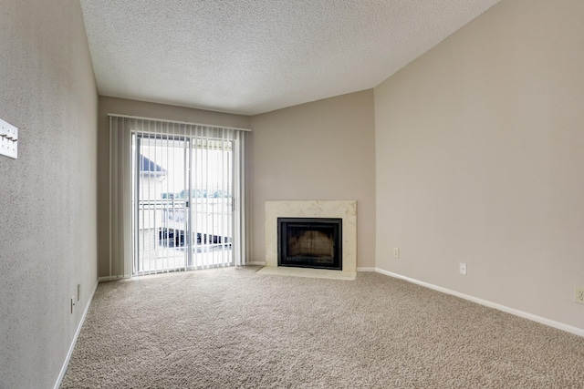 12550 Whittington Dr Unit 610, Houston, TX 77077 - unfurnished living room featuring a textured ceiling, carpet, and a fireplace