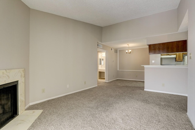 12550 Whittington Dr Unit 610, Houston, TX 77077 - unfurnished living room with a premium fireplace, carpet flooring, a chandelier, and a textured ceiling