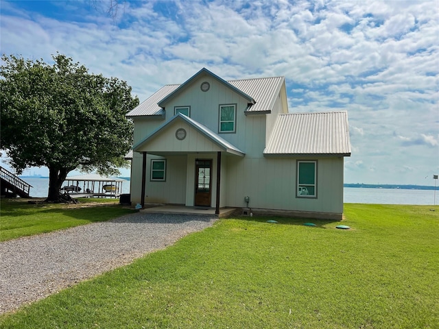 2263 Lcr 740, Thornton, TX 76687 - view of front of property featuring a metal roof, a front yard, a water view, and driveway