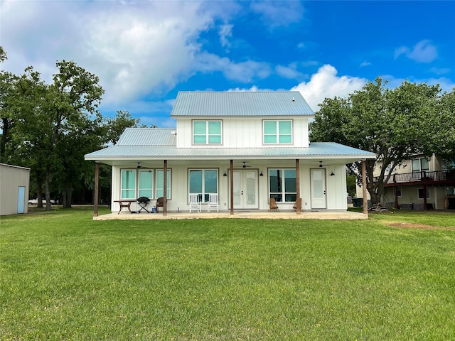 2263 Lcr 740, Thornton, TX 76687 - rear view of property featuring board and batten siding, a ceiling fan, a yard, and a metal roof