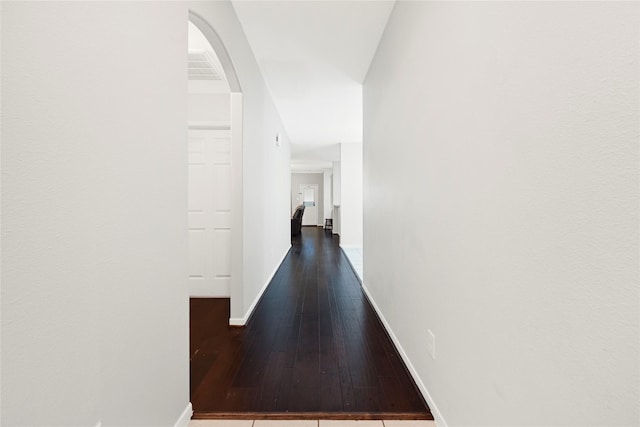 9002 Saint Laurent Ln, Houston, TX 77044 - corridor featuring dark wood-style floors and arched walkways