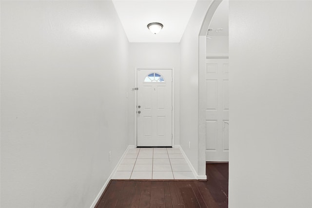 9002 Saint Laurent Ln, Houston, TX 77044 - doorway featuring arched walkways and hardwood / wood-style floors