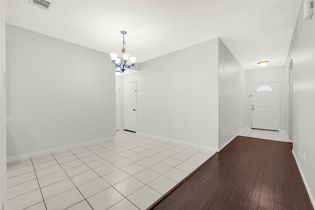 9002 Saint Laurent Ln, Houston, TX 77044 - entrance foyer featuring a chandelier and light wood-style flooring