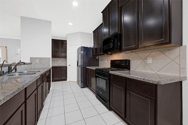 9002 Saint Laurent Ln, Houston, TX 77044 - kitchen featuring black appliances, tasteful backsplash, light tile patterned flooring, recessed lighting, and dark brown cabinets