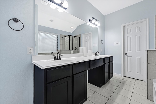 9002 Saint Laurent Ln, Houston, TX 77044 - full bath with a stall shower, double vanity, tile patterned flooring, vaulted ceiling, and a tub to relax in