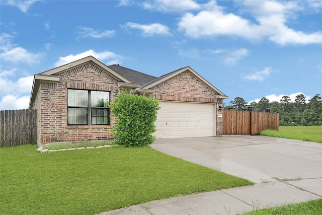 9002 Saint Laurent Ln, Houston, TX 77044 - ranch-style home with brick siding, concrete driveway, and an attached garage