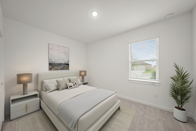 8410 Bay Oaks Dr, Baytown, TX 77523 - bedroom featuring light carpet and baseboards