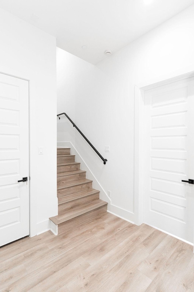 5703 Dolores St Unit A, Houston, TX 77057 - stairway with wood finished floors and baseboards