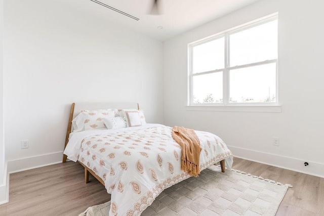 5703 Dolores St Unit A, Houston, TX 77057 - bedroom featuring wood finished floors and baseboards