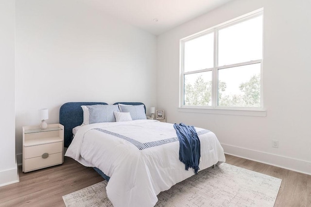 5703 Dolores St Unit A, Houston, TX 77057 - bedroom with wood finished floors and baseboards