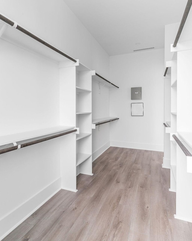 5703 Dolores St Unit A, Houston, TX 77057 - walk in closet featuring wood finished floors