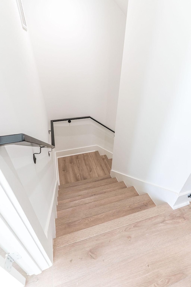 5703 Dolores St Unit A, Houston, TX 77057 - stairway with wood finished floors