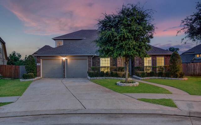 4639 Regal Shadow Ln, Sugar Land, TX 77479 - view of front of property with brick siding, an attached garage, driveway, and roof with shingles