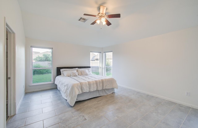 4639 Regal Shadow Ln, Sugar Land, TX 77479 - bedroom with multiple windows, ceiling fan, and light tile patterned flooring