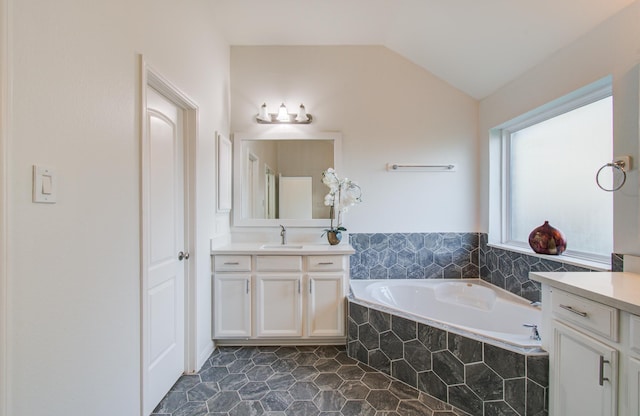 4639 Regal Shadow Ln, Sugar Land, TX 77479 - full bathroom featuring vanity, a garden tub, lofted ceiling, and tile patterned flooring