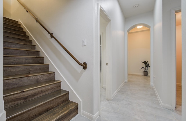 4639 Regal Shadow Ln, Sugar Land, TX 77479 - stairs featuring arched walkways and tile patterned floors