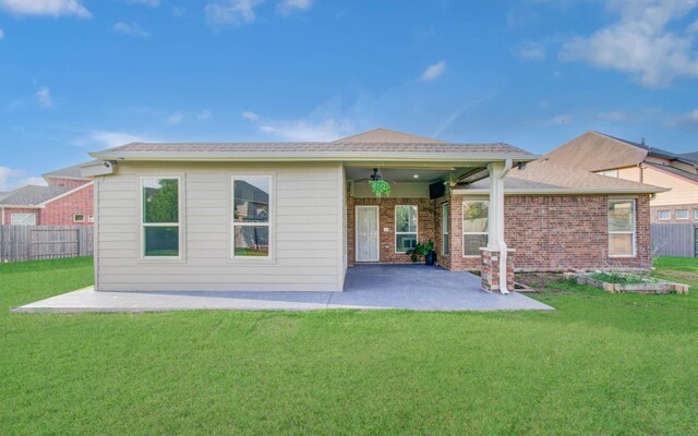 4639 Regal Shadow Ln, Sugar Land, TX 77479 - back of property featuring a ceiling fan, a patio area, and brick siding