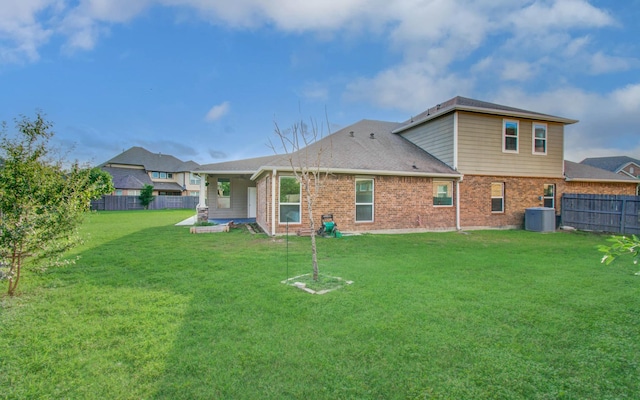 4639 Regal Shadow Ln, Sugar Land, TX 77479 - rear view of house featuring a fenced backyard, brick siding, and a patio area