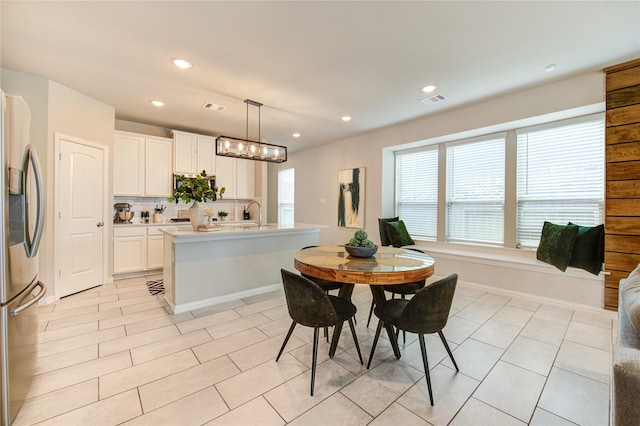 17715 White Lightning Way, Spring, TX 77379 - dining space with light tile patterned floors and recessed lighting